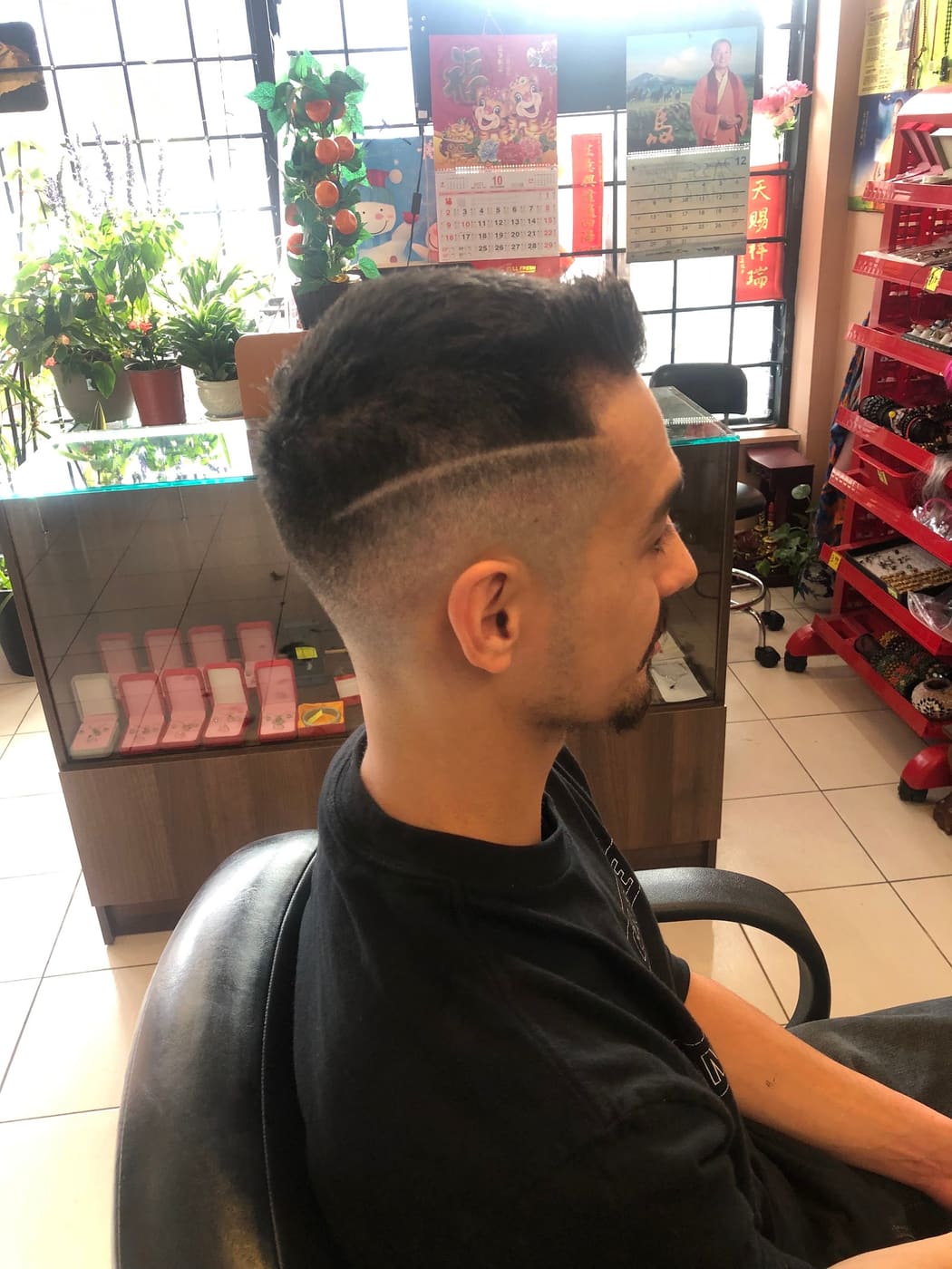 Fade with shaved hard part, side profile
