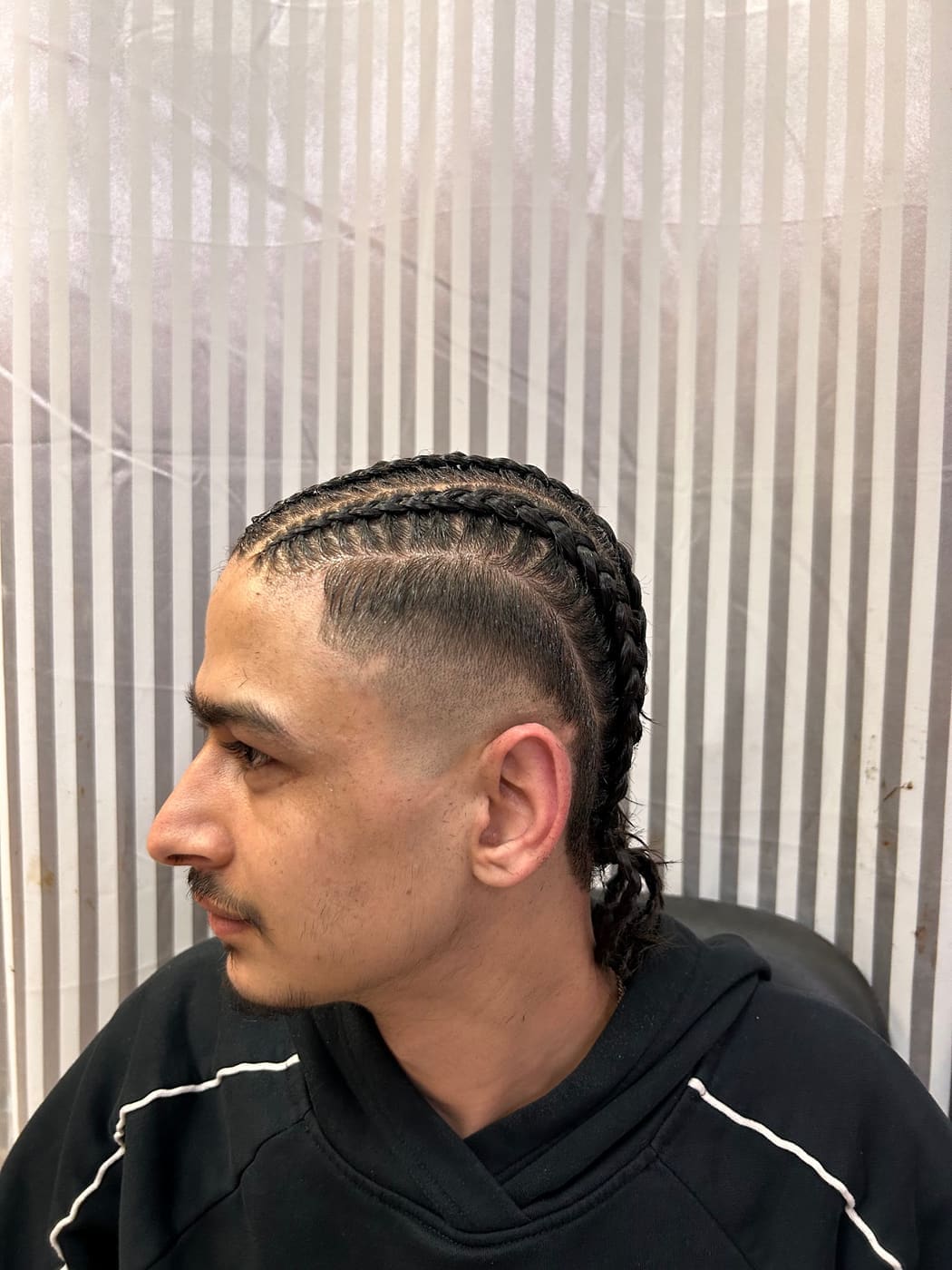 Cornrow braids with fade, side profile
