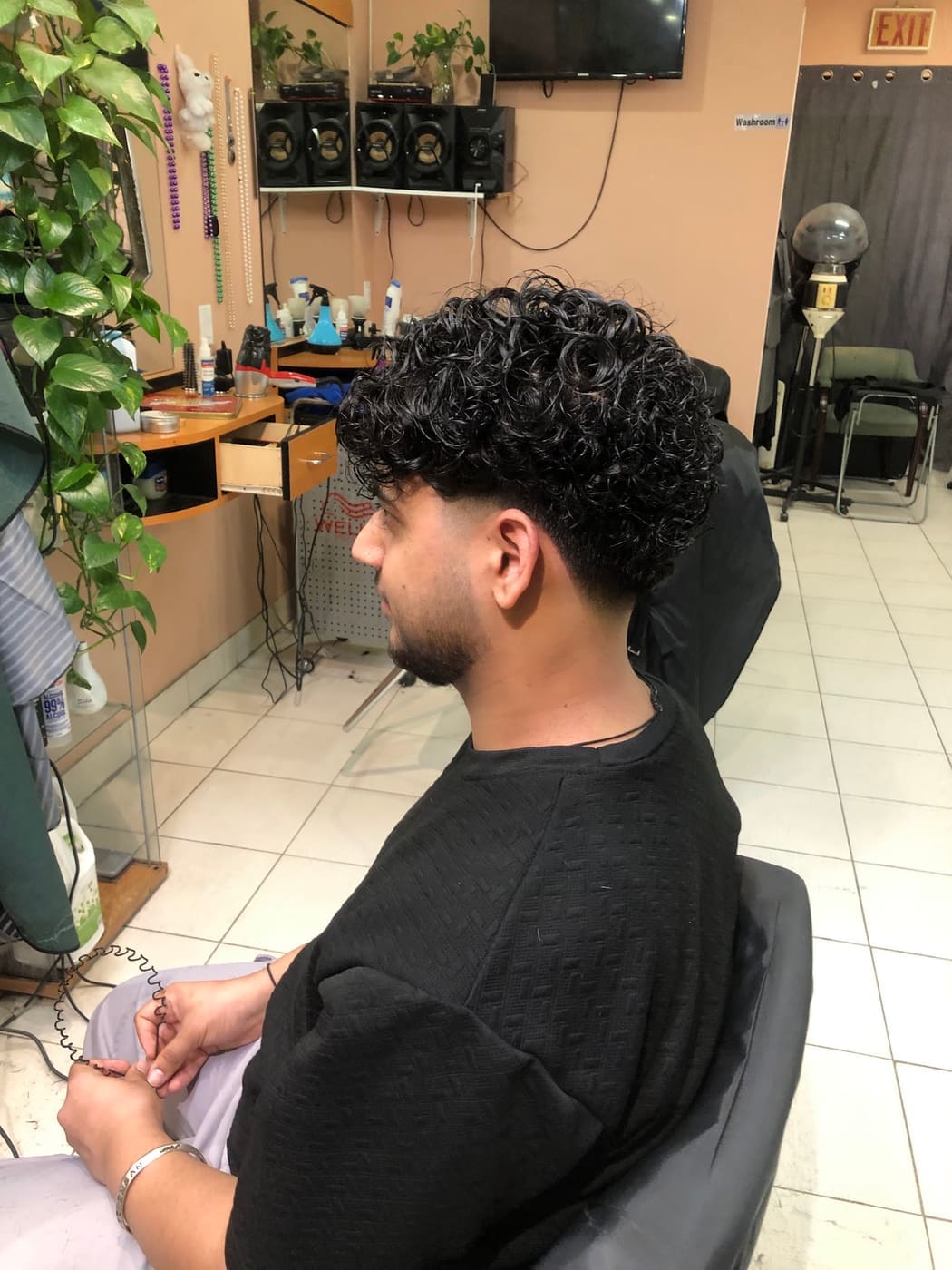Curly hair styling, client in chair