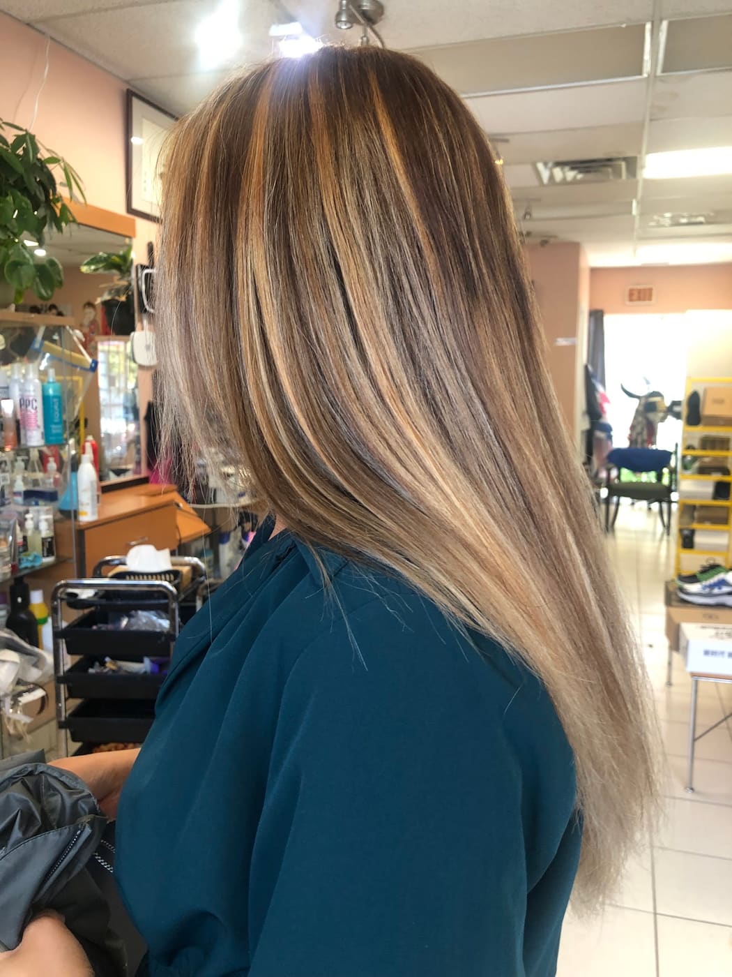 Blonde balayage on long hair, side view